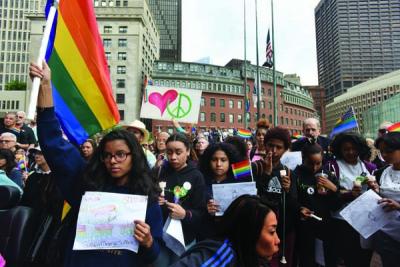 Orlado vigil: Bostonians gathered on City Hall Plaza on June 13 for a vigil in memory of the victims of the Pulse nightclub shooting in Orlando. Forty-nine innocent people were killed by a gunman armed with an assault rifle. Photo by Isabel Leon/Mayor’s Office